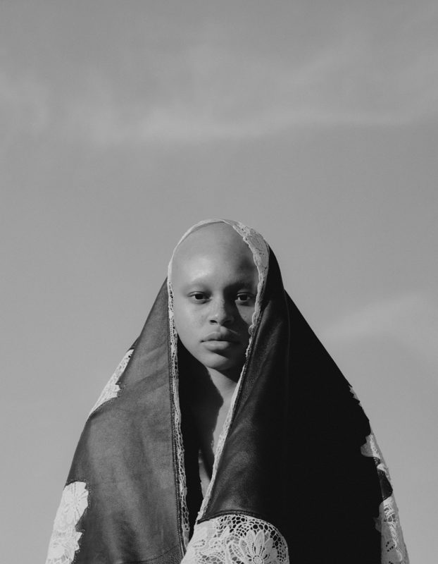 BLACK LEATHER COAT WITH IVORY ENDANGERED LACE Photography Alex Black - Alexander McQueen special, Lampoon Issue 20