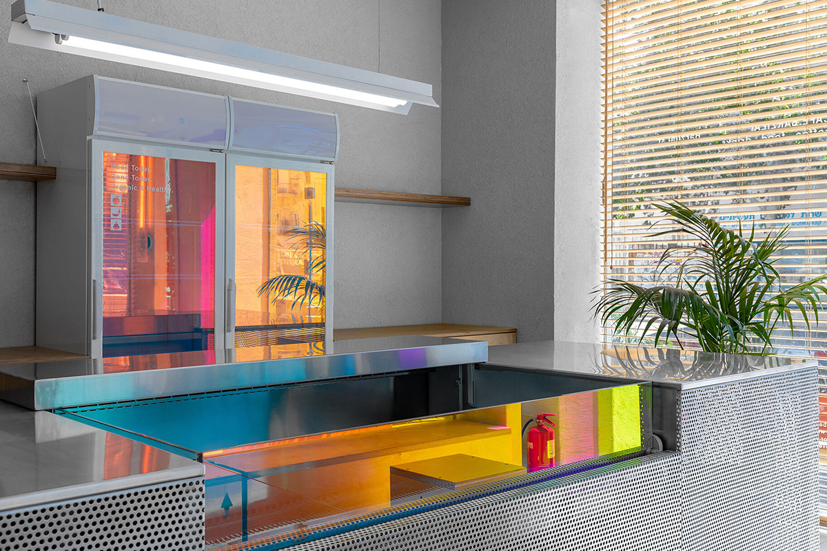 Cafe Barzilay, Tel Aviv. Simon Barazin uses dichroic glass to create colorful + reflective cafe interior in tel aviv