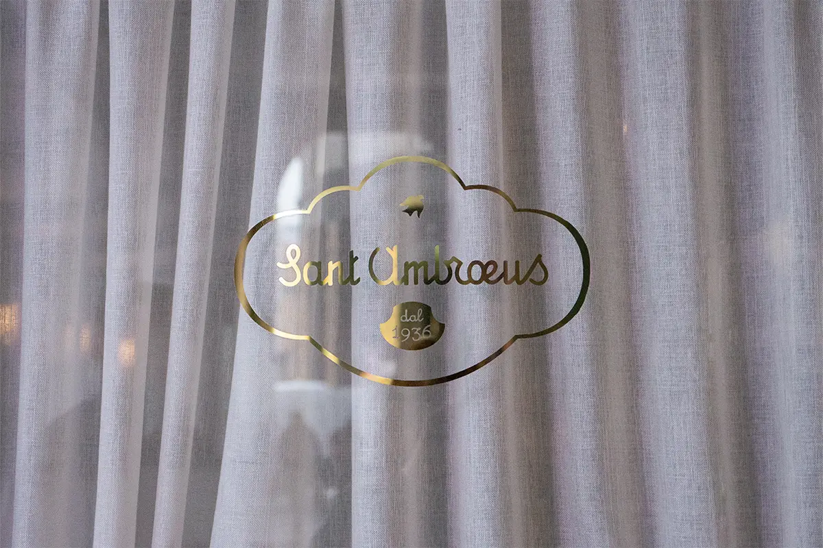 Sant Ambroeus logo restaurant's window entrance