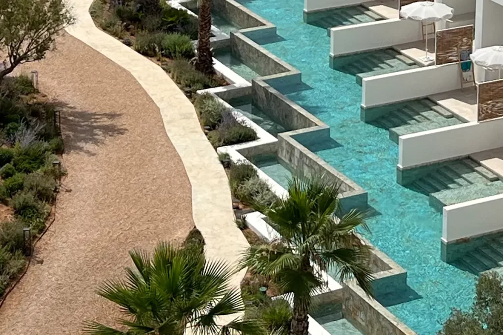 TRS Ibiza Hotel, a strip of building houses other rooms, each with a pool on the ground floor