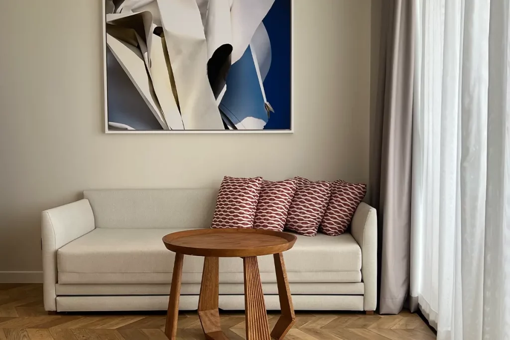 The color is in the abstract painting above the sofa